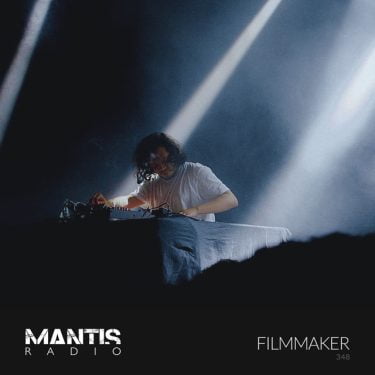 Filmmaker performing live on stage - Mantis Radio