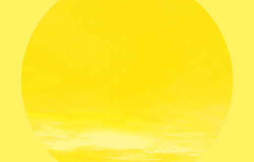 Yellow background with a circle taking up most the area, with a yellow overlaid sky.