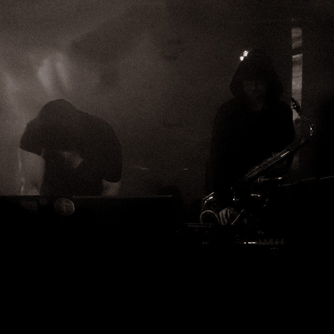 dark shadowy photo taken of A Vengeance performing in Scotland.